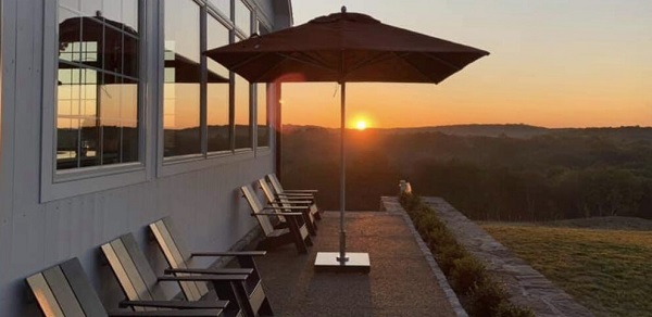 parasol on a terrace with sunset in background