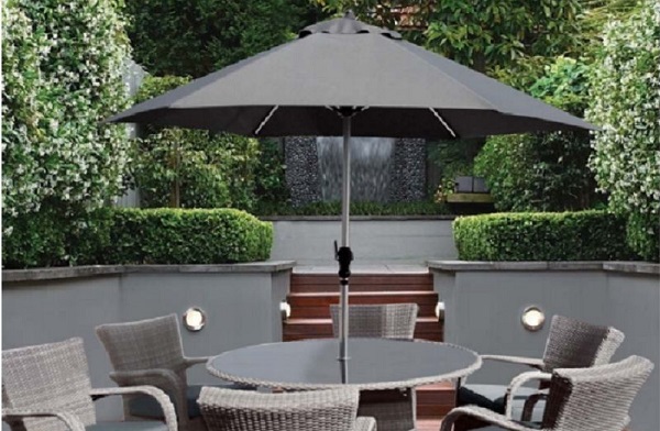 small balcony parasol with round table and chairs